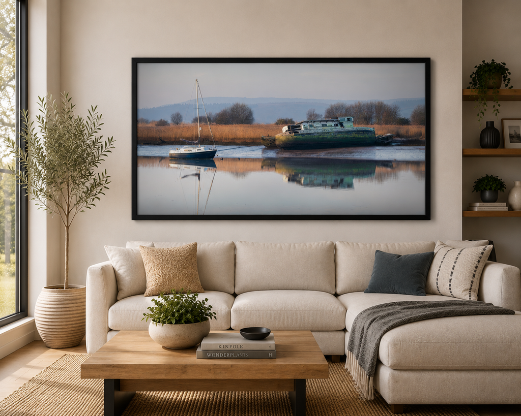 Passing Time

Two vessels, two very different stories, resting quietly beside one another. The small sailing boat waits patiently on the still water, while the weathered remains of an old vessel slowly surrender to time. Photographed in Topsham, Devon, England, by Roy Anderson.
