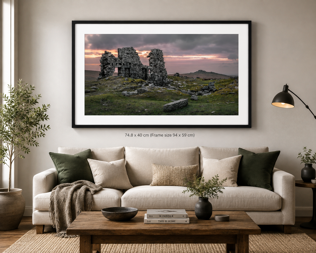 “Echoes of Foggintor fine art photograph of historic Dartmoor quarry ruins, displayed in a black frame above a contemporary living room sofa.”